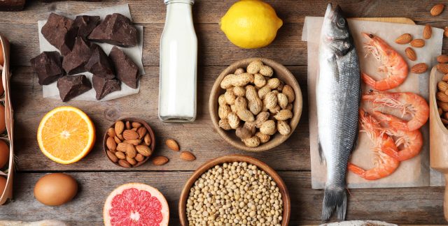 A table with chocolate, milk, peanuts, fish, shellfish, almonds, oranges, eggs and more