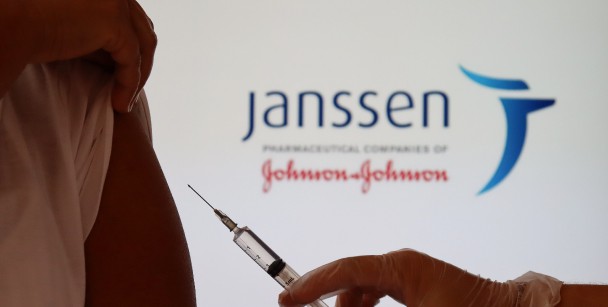 A close-up of an arm and a vaccine injection with a Janssen Johnson & Johnson logo a an emergency room in Houston, TX