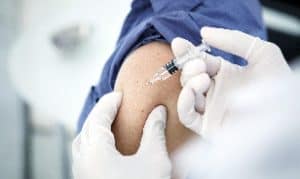 A closeup of a person receiving a vaccine in Houston, TX

