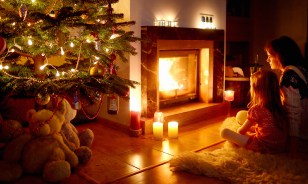 A peaceful holiday evening lit by candles and lights in a tree can be incredibly romantic and lovely, but make sure you’re using safe practices with the electrical threats and any live flames.