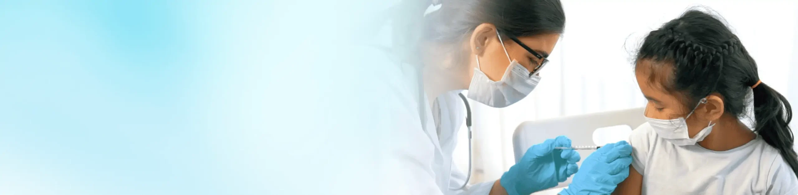 A doctor gives a COVID-19 vaccine to a child in Houston, TX