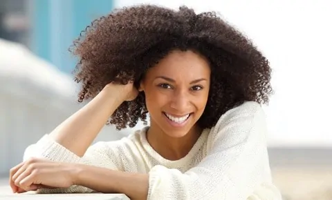 A female patient smiles after her visit to the emergency room in Houston, TX