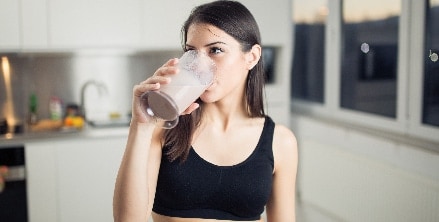 A woman drinks chocolate milk in Houston, TX